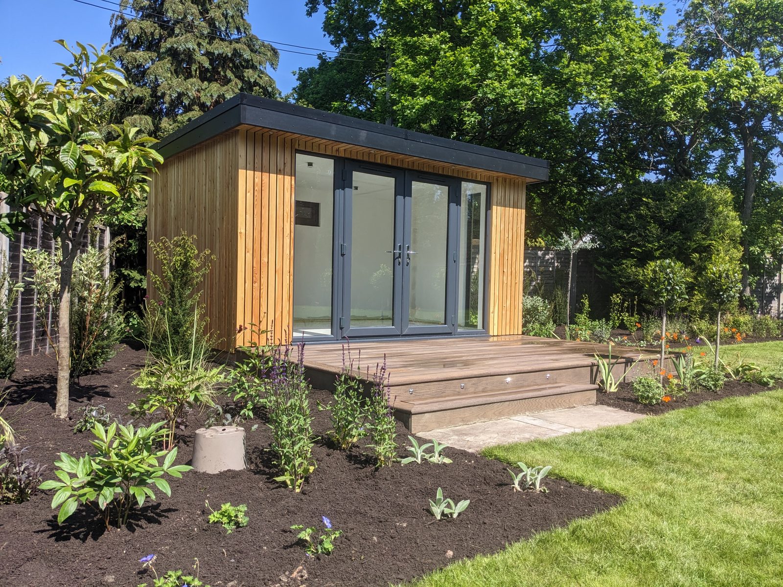 One of our garden rooms, with a deck, steps and new planting