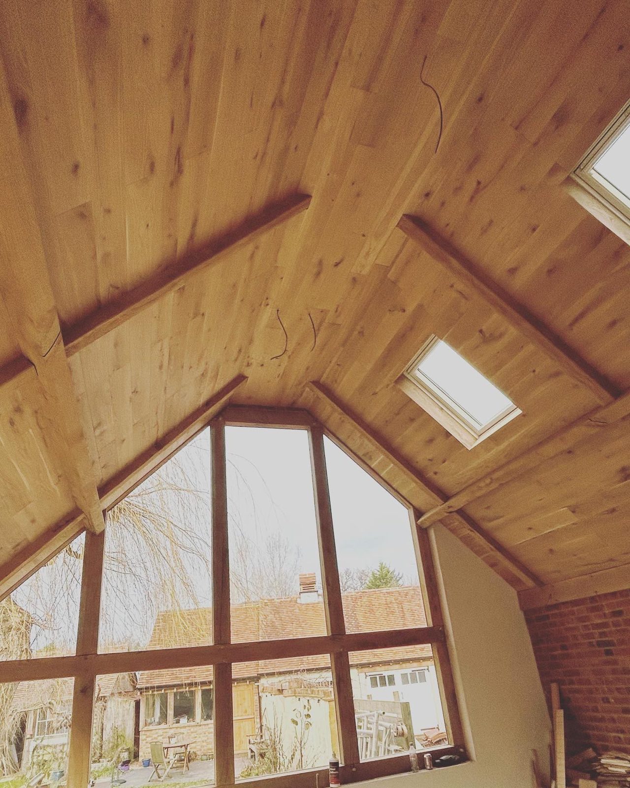 An extension we built, with a vaulted oak ceiling and a glazed gable
