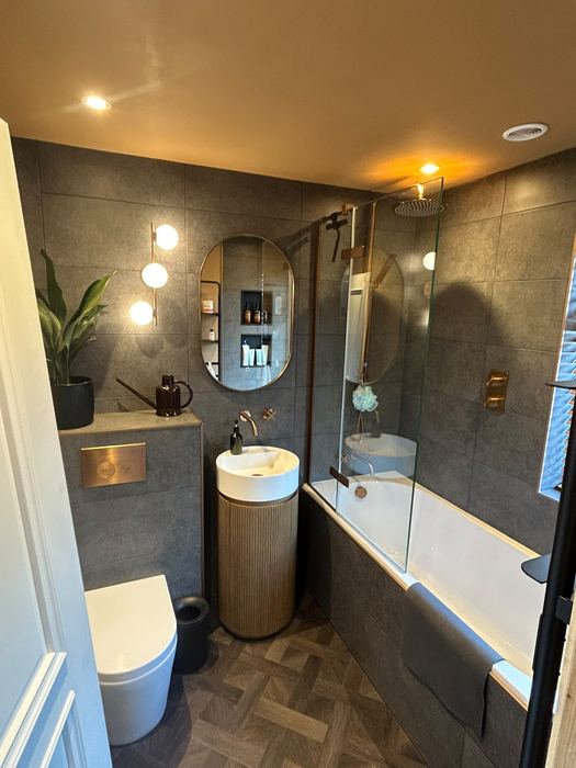 Tiled bathroom with brushed brass fittings