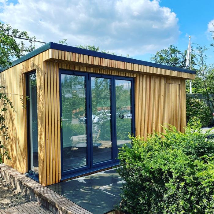 Cedar garden room with bi-fold doors