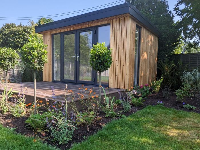 Garden room with planted borders