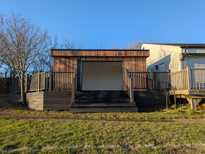 Cedar-clad garden room on a raised deck