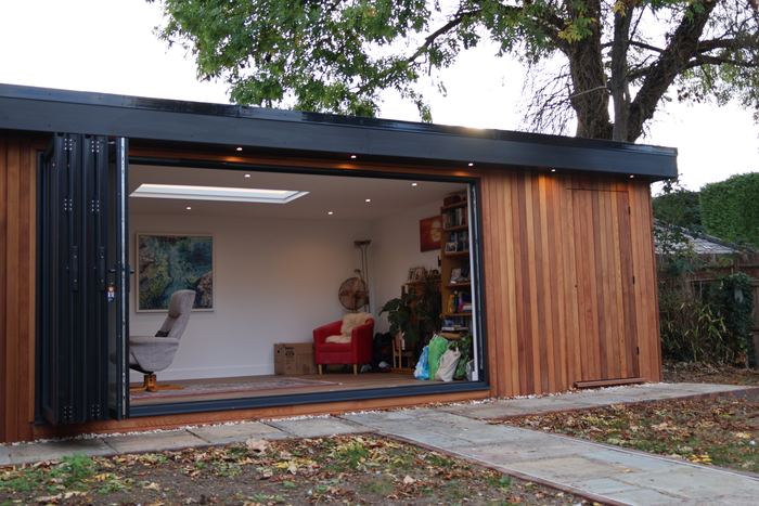Bi-fold doors folded back, looking into the room