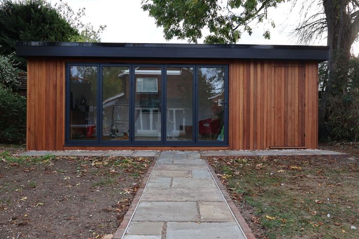 The garden room from the end of the paved path, doors closed