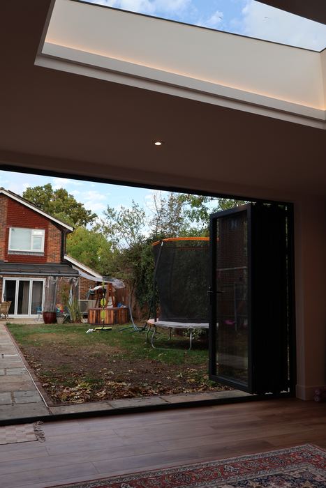 Looking out from inside, under the roof light, with the doors open